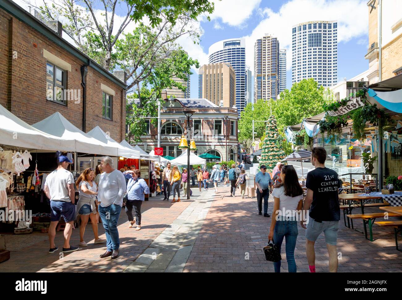 The Rocks market, Sydney Australia - people shopping at the stalls on a sunny day in summer, the Rocks, Sydney Australia Stock Photo