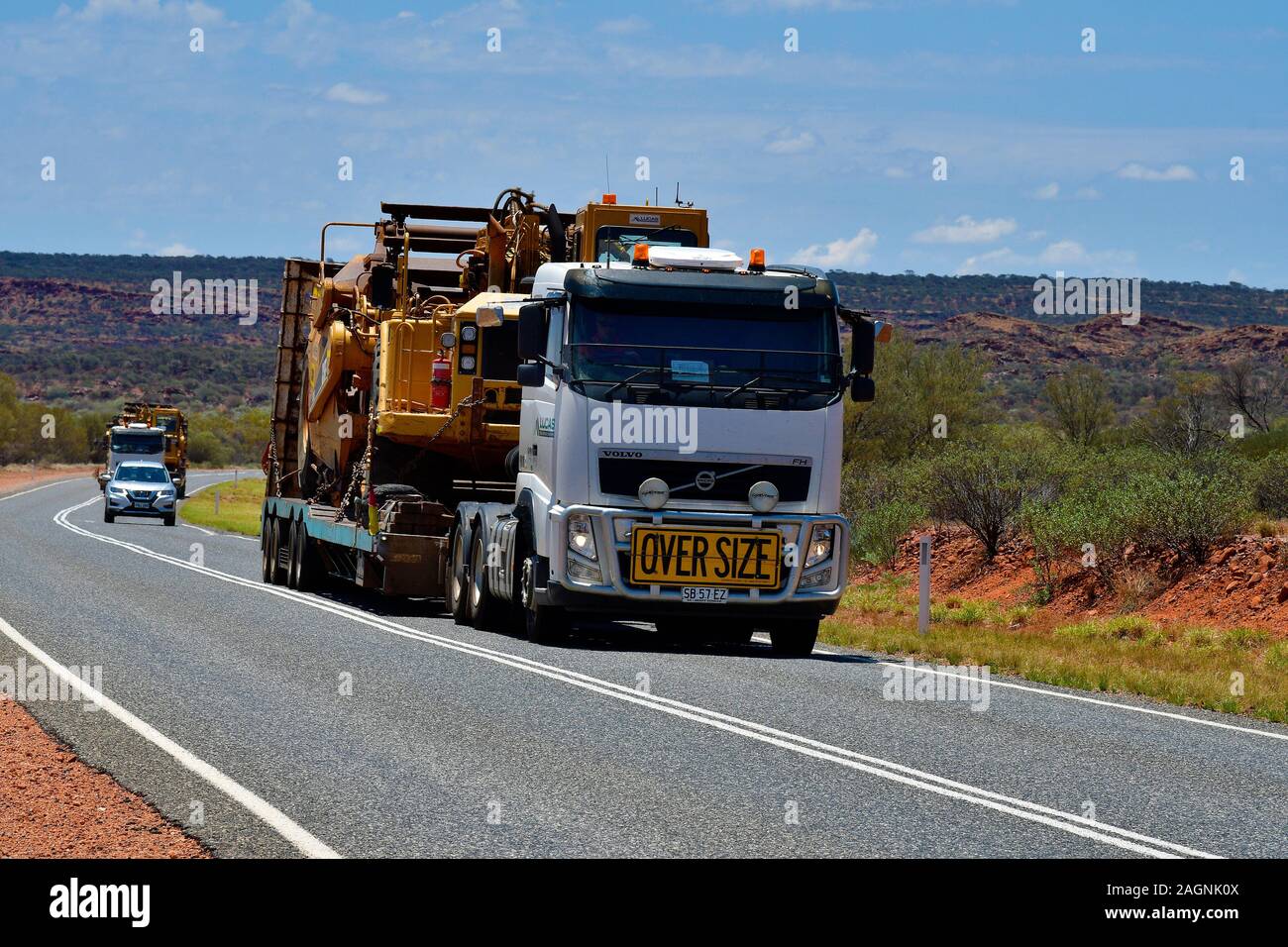 Australia, November 15, 2017: Heavy truck named Road Train load with mining vehicle on Stuart Highway Stock Photo
