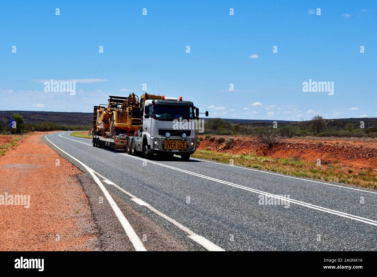 Australia, truck named Road Train load with mining vehicle on Stuart Highway Stock Photo