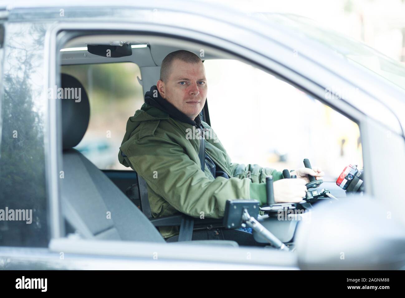 Car with steering wheel for disabled drivers Stock Photo