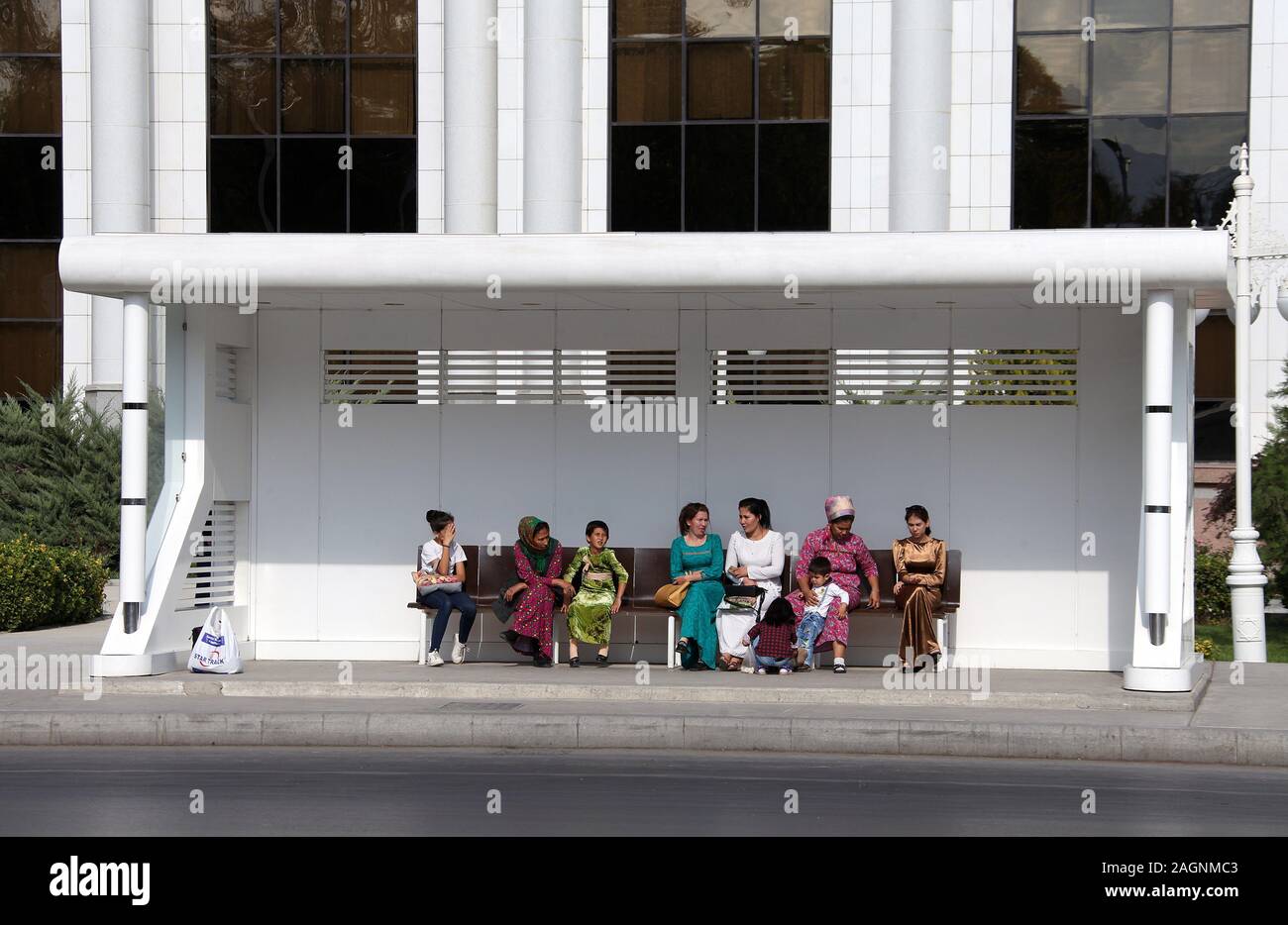 People waiting for a bus in the city centre of Ashgabat Stock Photo