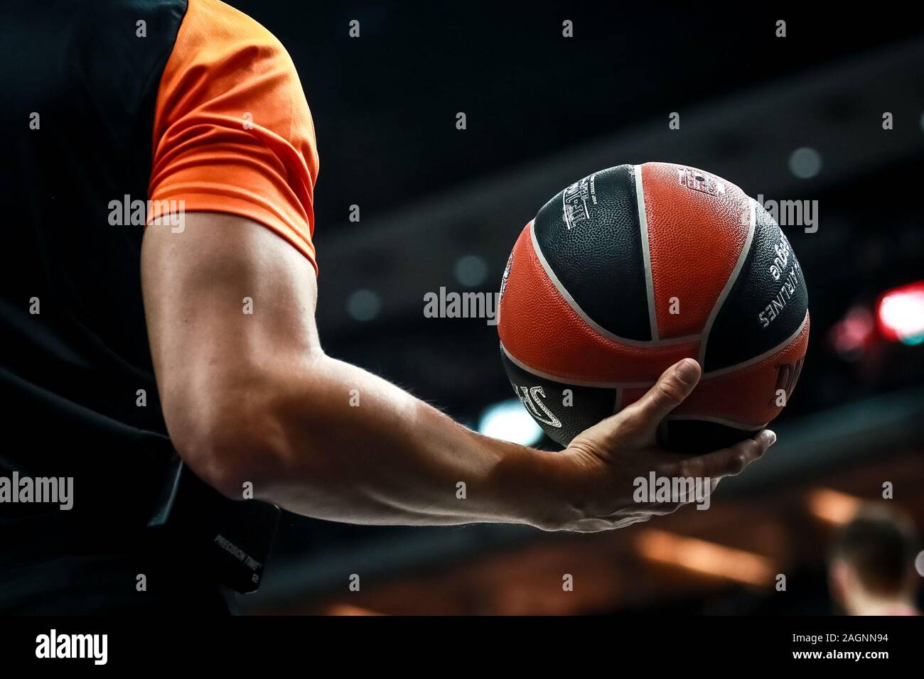 Berlin, Germany, December 18, 2019:a referee holds the official basket game ball during a EuroLeague match between Alba Berlin and FC Bayern Munich Stock Photo