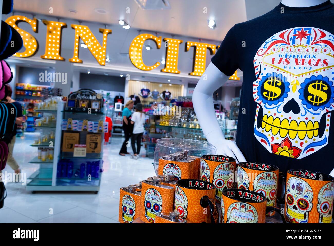 Interior shot of a large Sin City sign and skull t-shirt and mugs on display in a souvenir shop inside the Forum Shops, Las Vegas, Nevada, USA Stock Photo