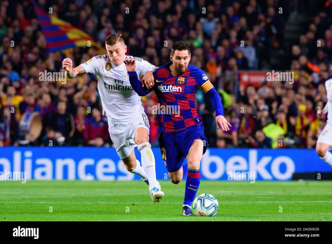BARCELONA - DEC 18: Kroos (L) and Messi (R) play at the La Liga match between FC Barcelona and Real Madrid at the Camp Nou Stadium on December 18, 201 Stock Photo