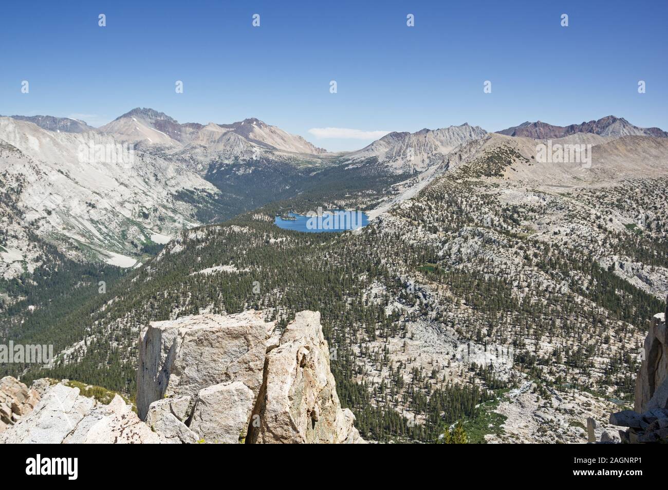 view from Arrow Peak over Bench Lake towards Taboose Pass and Striped Split and Cardinal Mountains Stock Photo