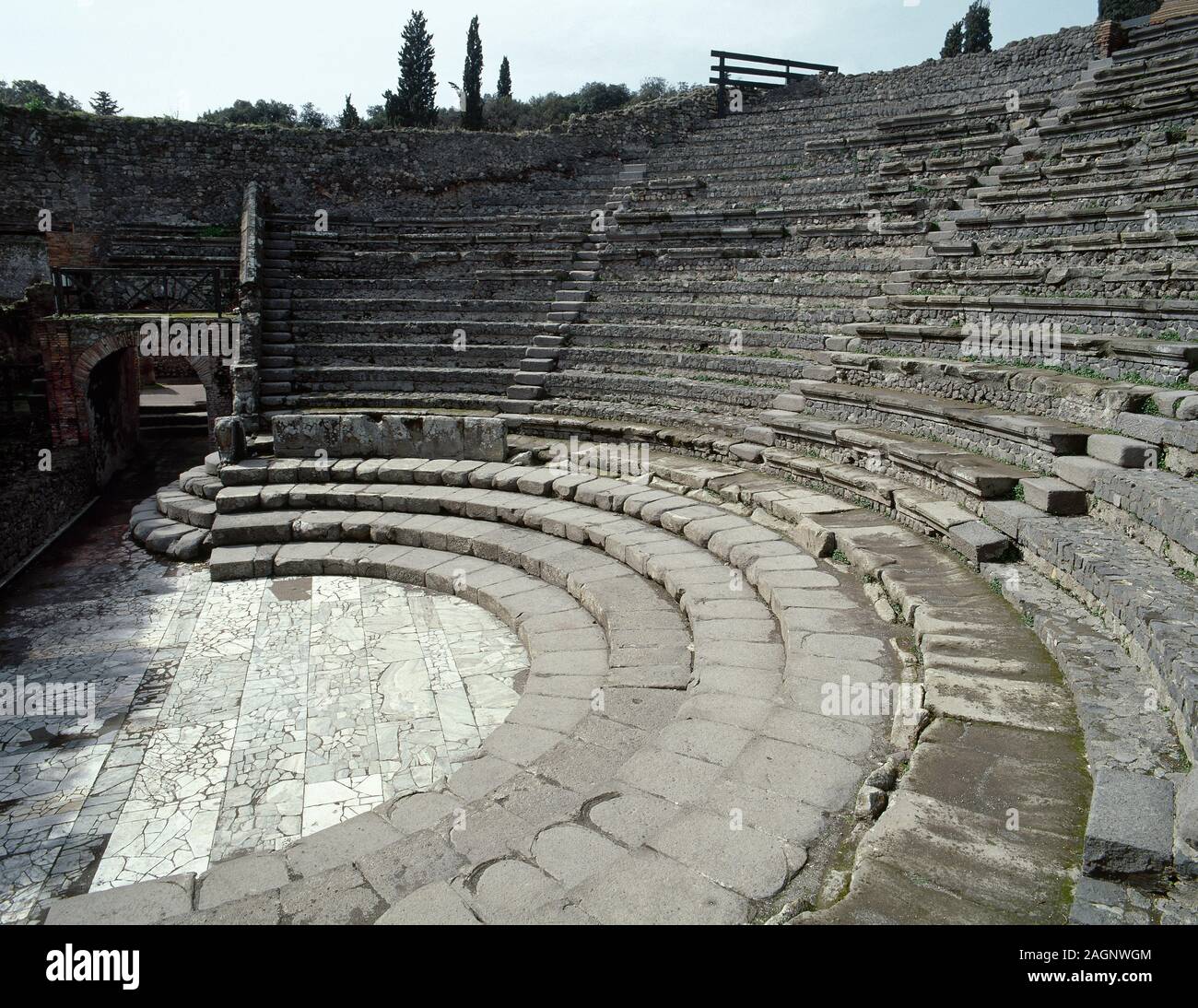 Italy. Pompeii. Ancient Roman city destroyed by the eruption of the Vesuvius in 79 AD. Small Theatre or Odeon, built in 80 BC. Cavea. View of the orchestra and caveas. Campania. Stock Photo