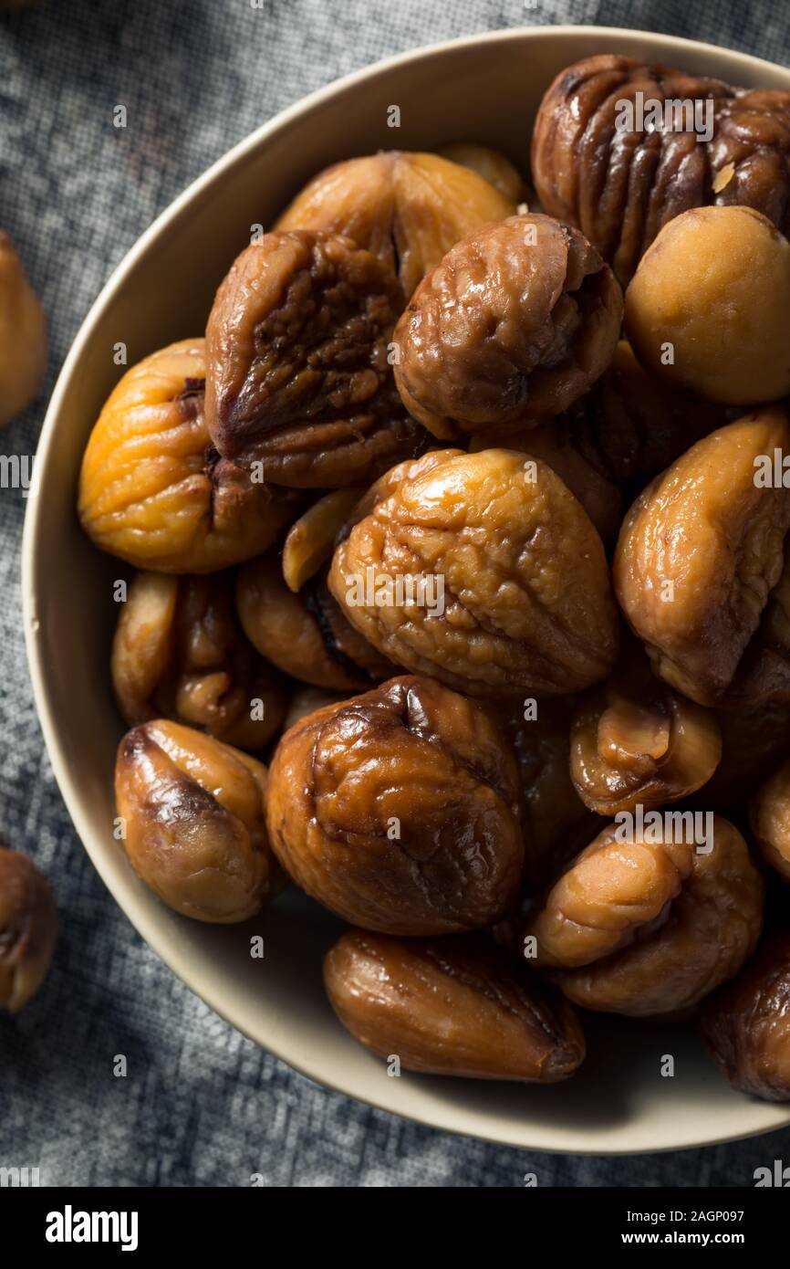 Organic Shelled Roasted Chestnuts in a Bowl Stock Photo