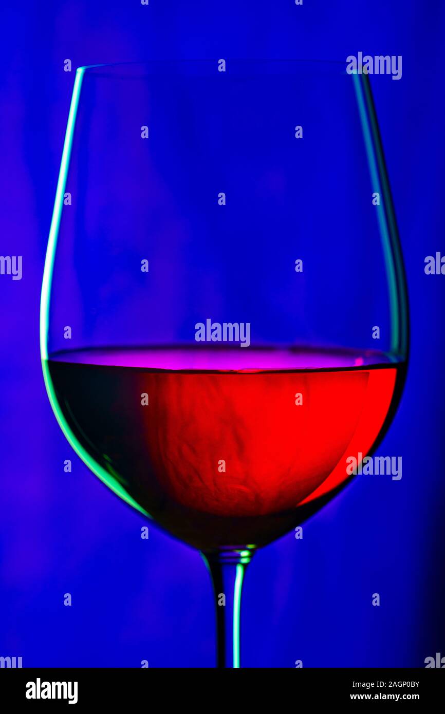 Glass of red wine on dark blue background Stock Photo