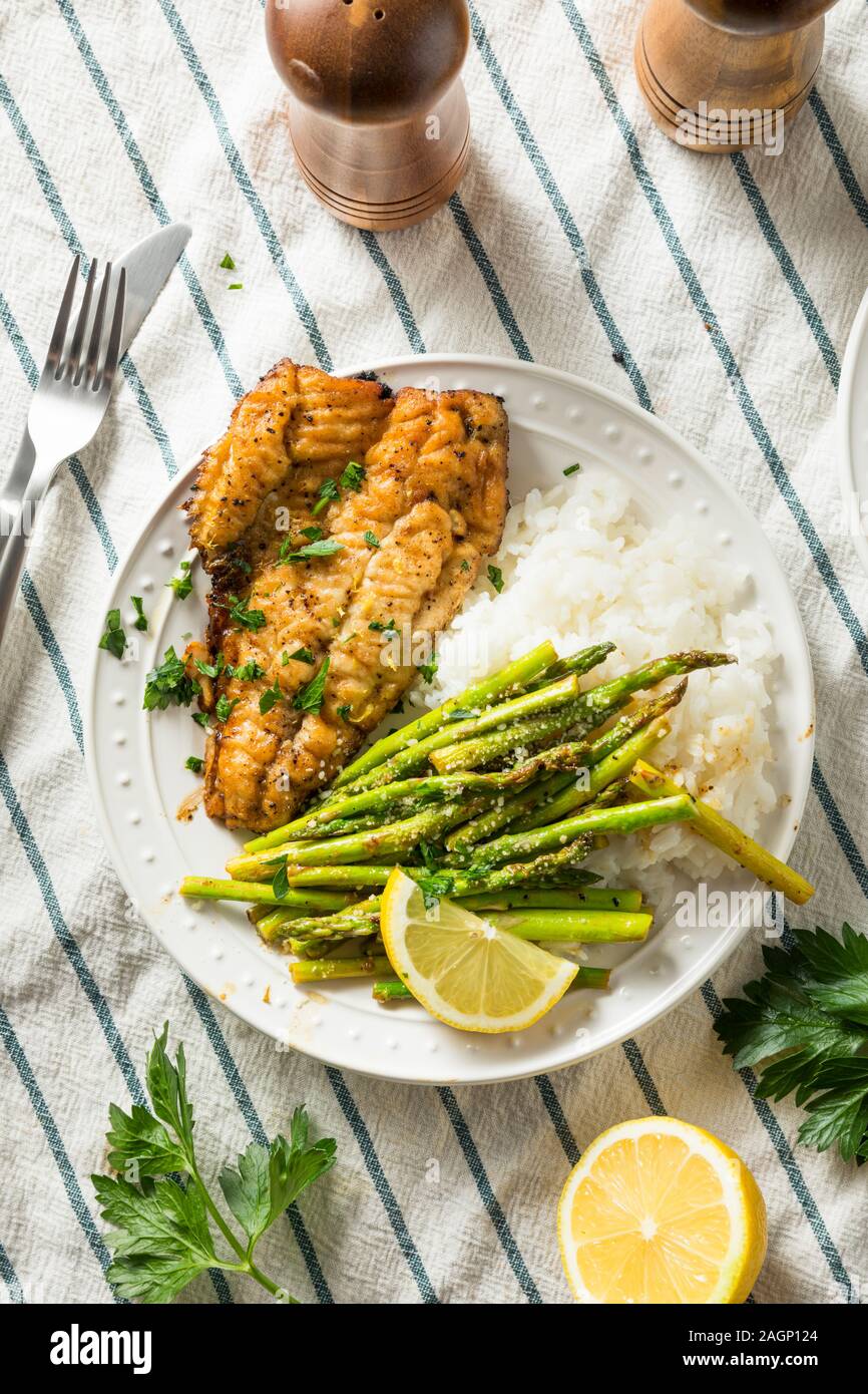 Homemade Sauteed Whitefish Dinner with Asparagus and Rice Stock Photo