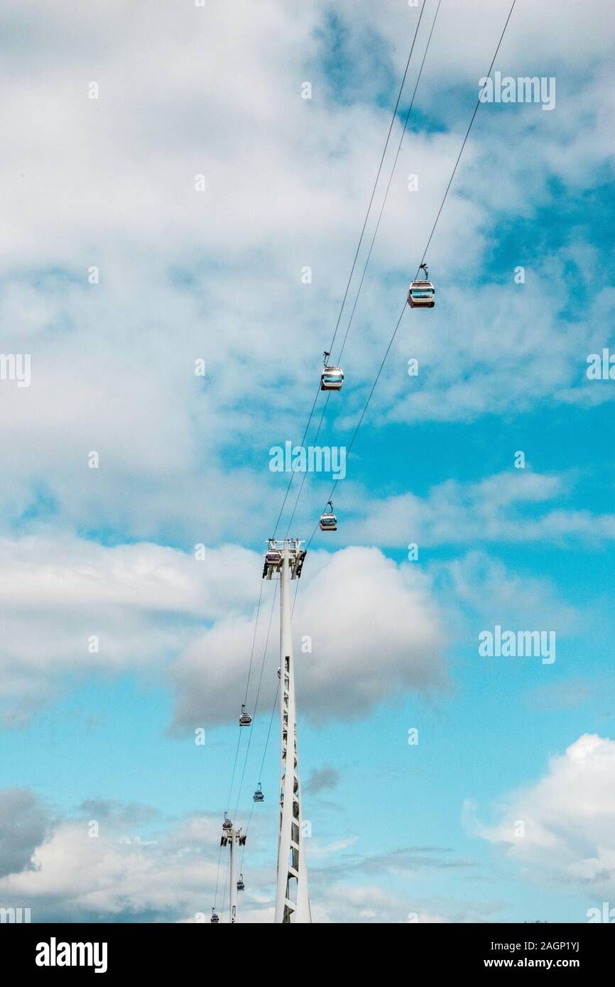 Cable cars travel high above London as they cross from one side of the River Thames to the other. Stock Photo