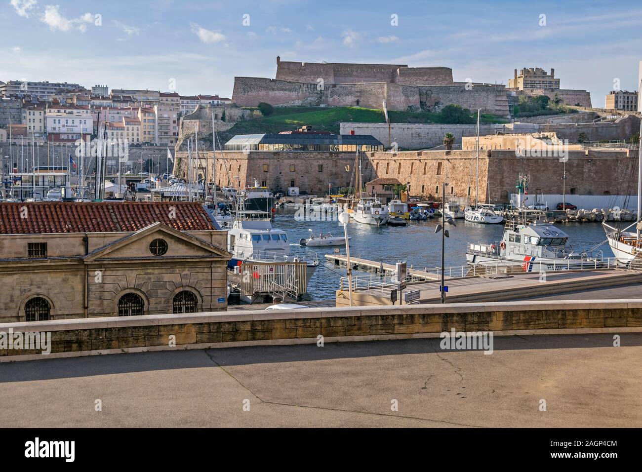 Marseille, France - November 1, 2019: View from the Vaudoyer Sreet at the Old Port with all kinds of boats and Fort Saint-Nicolas built on Louis XIV’s Stock Photo