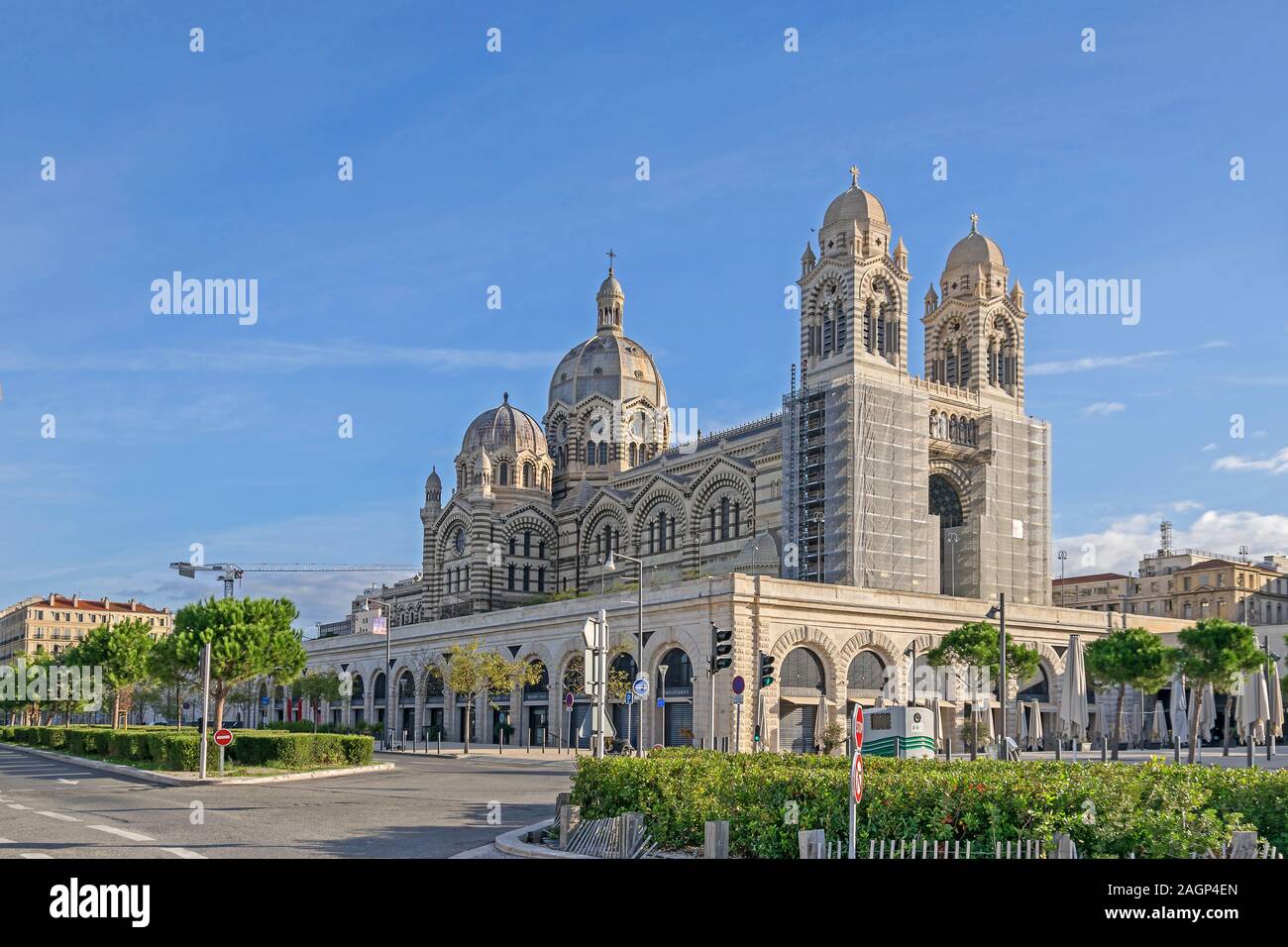 Marseille, France - November 1, 2019: Boulevard Jacques Saade with shops and restaurants and the new Cathedral of Saint Mary Major, the seat of the Ar Stock Photo
