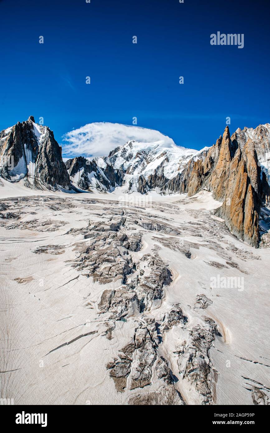 Mont Blanc, the roof of Europe with its 4808 meters above sea level, is a collection of peaks. Overlooking the sea of ice the Grandes Jorasses, the Stock Photo