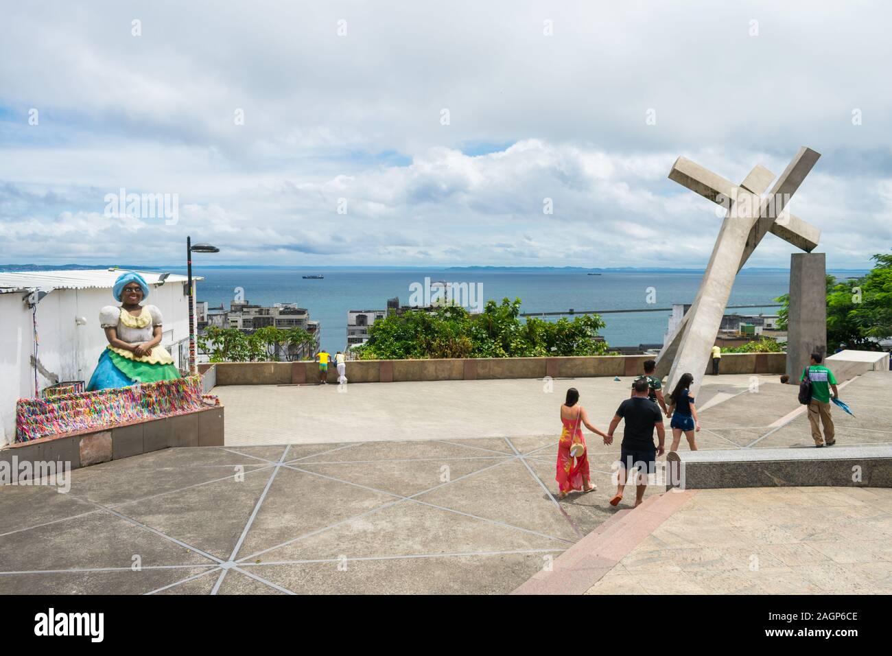 Salvador, Brazil - Circa September 2019: Statue of the Memorial of the Baianas and the fallen cross, two landmarks located at Se Square Stock Photo