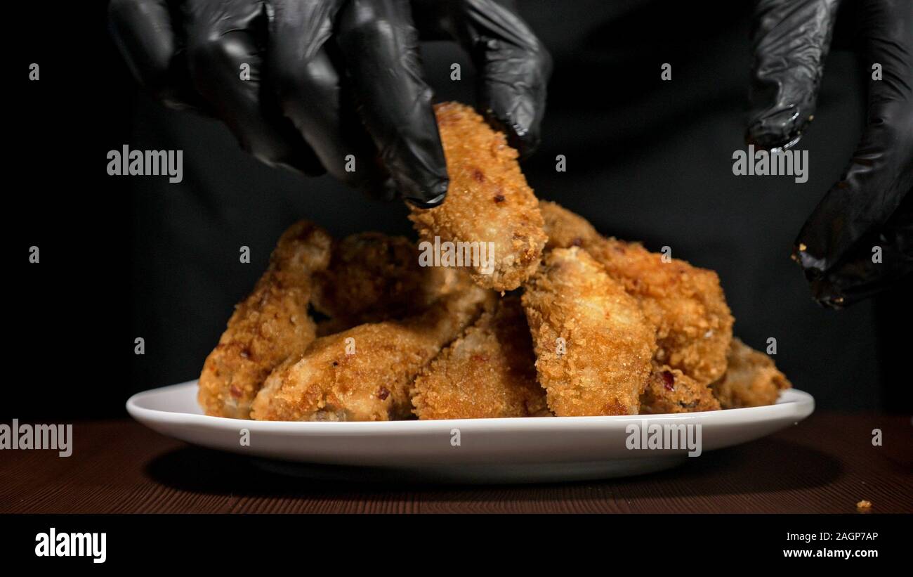 Cool beautiful fresh juicy cooked chicken wings in breading. Buffalo
