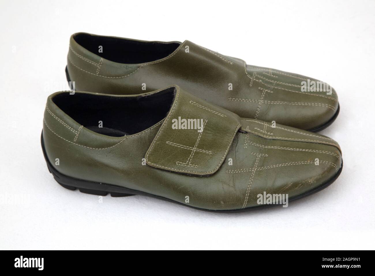 A Pair of Argentinian Green Leather Shoes with Velcro Fastening Stock Photo
