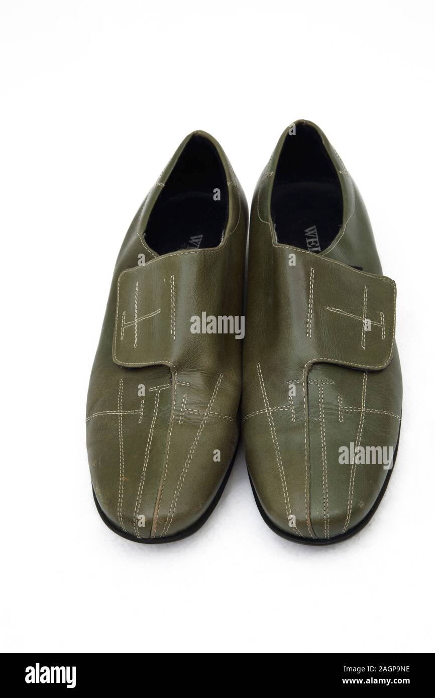 A Pair of Argentinian Green Leather Shoes with Velcro Fastening Stock Photo