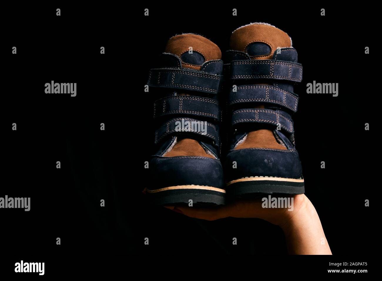 Orthopedic footwear. Winter footwear. Orthopedic baby shoes. Stock Photo