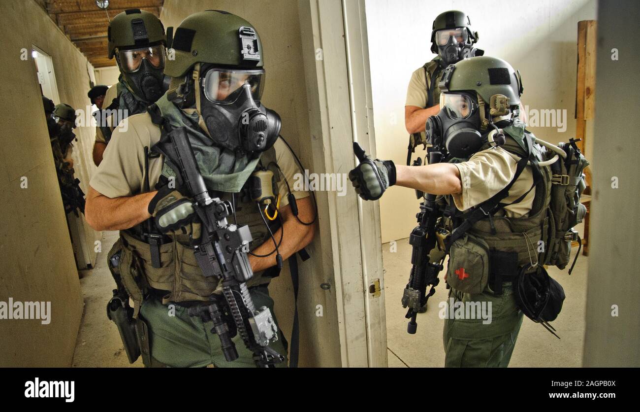 FBI SWAT - Special Weapons And Tactics team practices an interior assault. Stock Photo