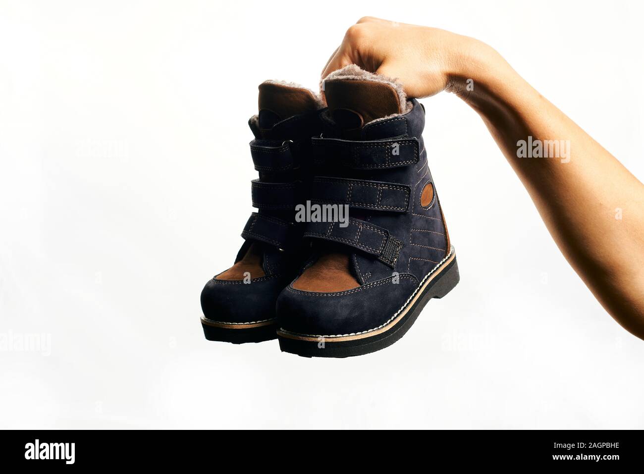 Orthopedic footwear. Winter footwear. Orthopedic baby shoes. Stock Photo