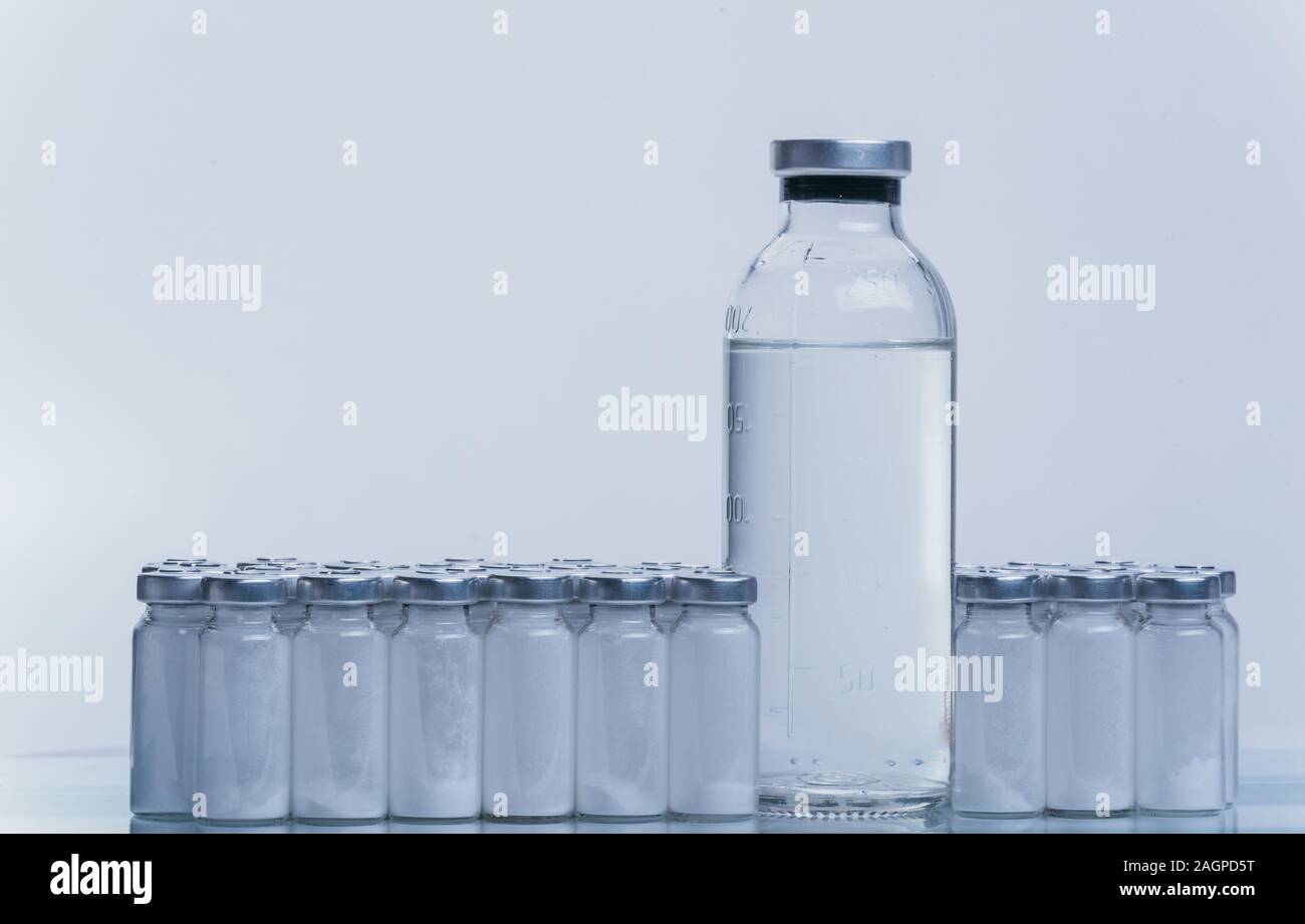 Glass medical ampoule vial for injection. Medicine is dry white drug ...