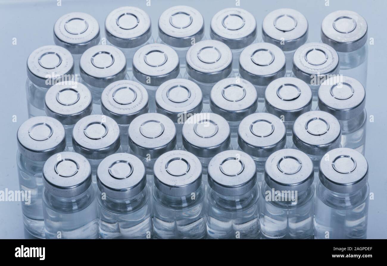 Glass medical ampoule vial for injection. Medicine is dry white drug ...