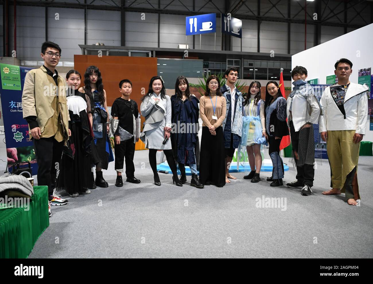(191220) -- NEW YORK, Dec. 20, 2019 (Xinhua) -- Models present creations by Chinese college students during a side event of the United Nations Climate Change Conference (COP25) in Madrid, Spain, on Dec. 12, 2019. Unilateralism and protectionism have been eroding the global governance system throughout 2019, prompting widespread concern among members of the international community. Braving such headwinds, China has been doing its utmost to defend multilateralism, via concrete actions such as paying in full all it owes for the 2019 UN regular budget, actively participating in climate action, str Stock Photo