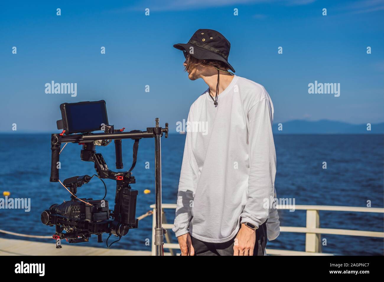 Stabilizer Operator Professional steadicam operator uses a 3-axis camera stabilizer system ...