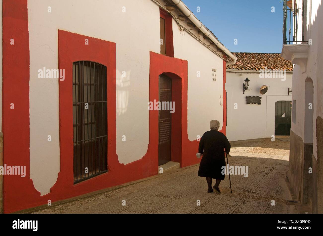 Typical alley and old woman, Alajar, Huelva province, Region of Andalusia, Spain, Europe. Stock Photo