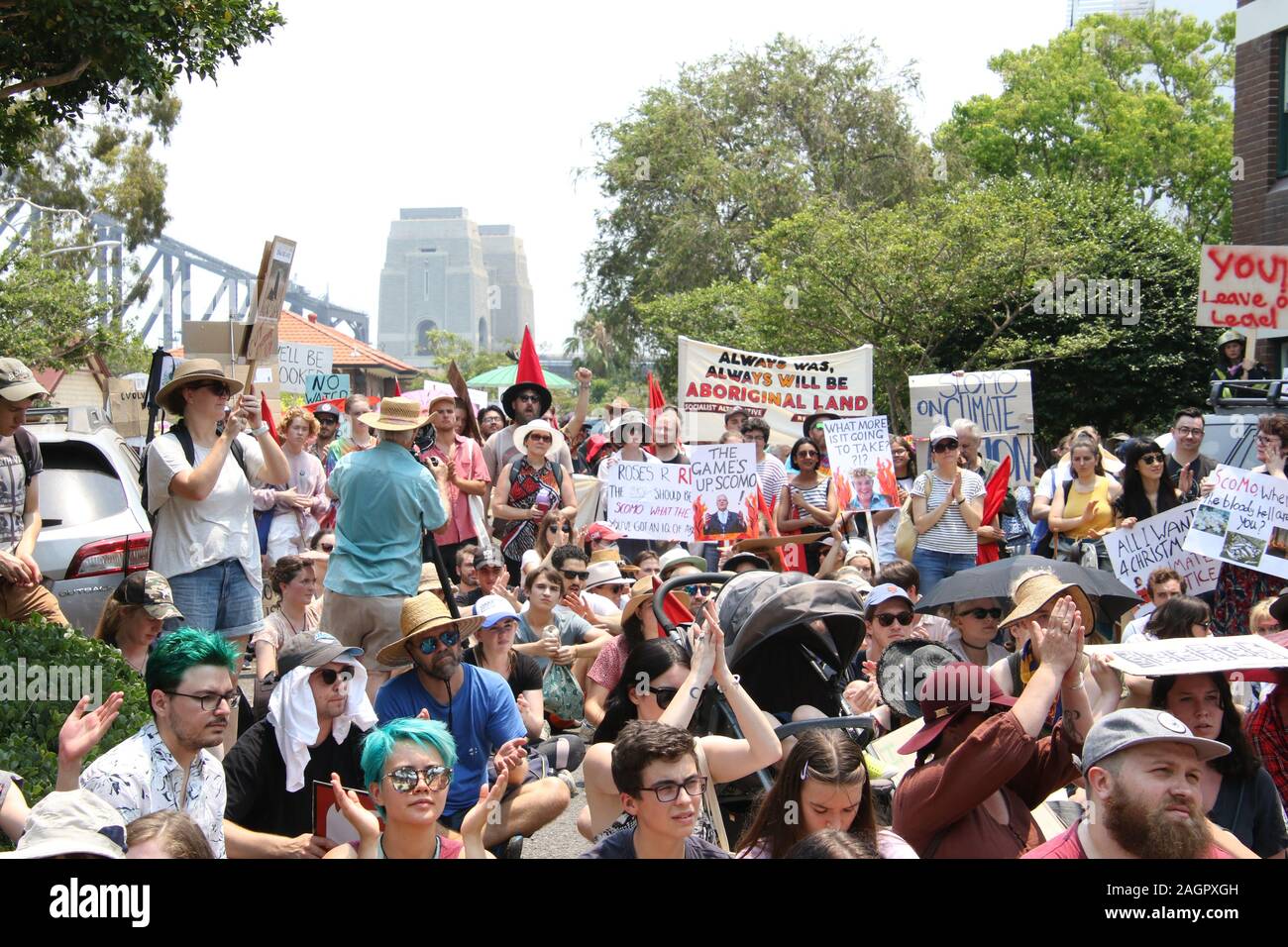 Sydney, Australia. 21st December 2019. Climate change protesters gathered at First Fleet Park and listened to various speakers before marching across the Sydney Harbour Bridge to the Prime Ministers official residence at Kirribilli House. Credit: Richard Milnes/Alamy Live News Stock Photo