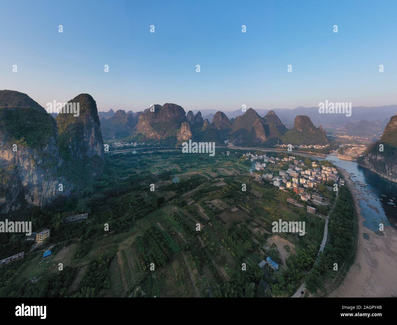 Sunrise over Xingping karsts hills in Xianggong hill and Li river at sunset near Yangshuo in Guanxi province, China Stock Photo