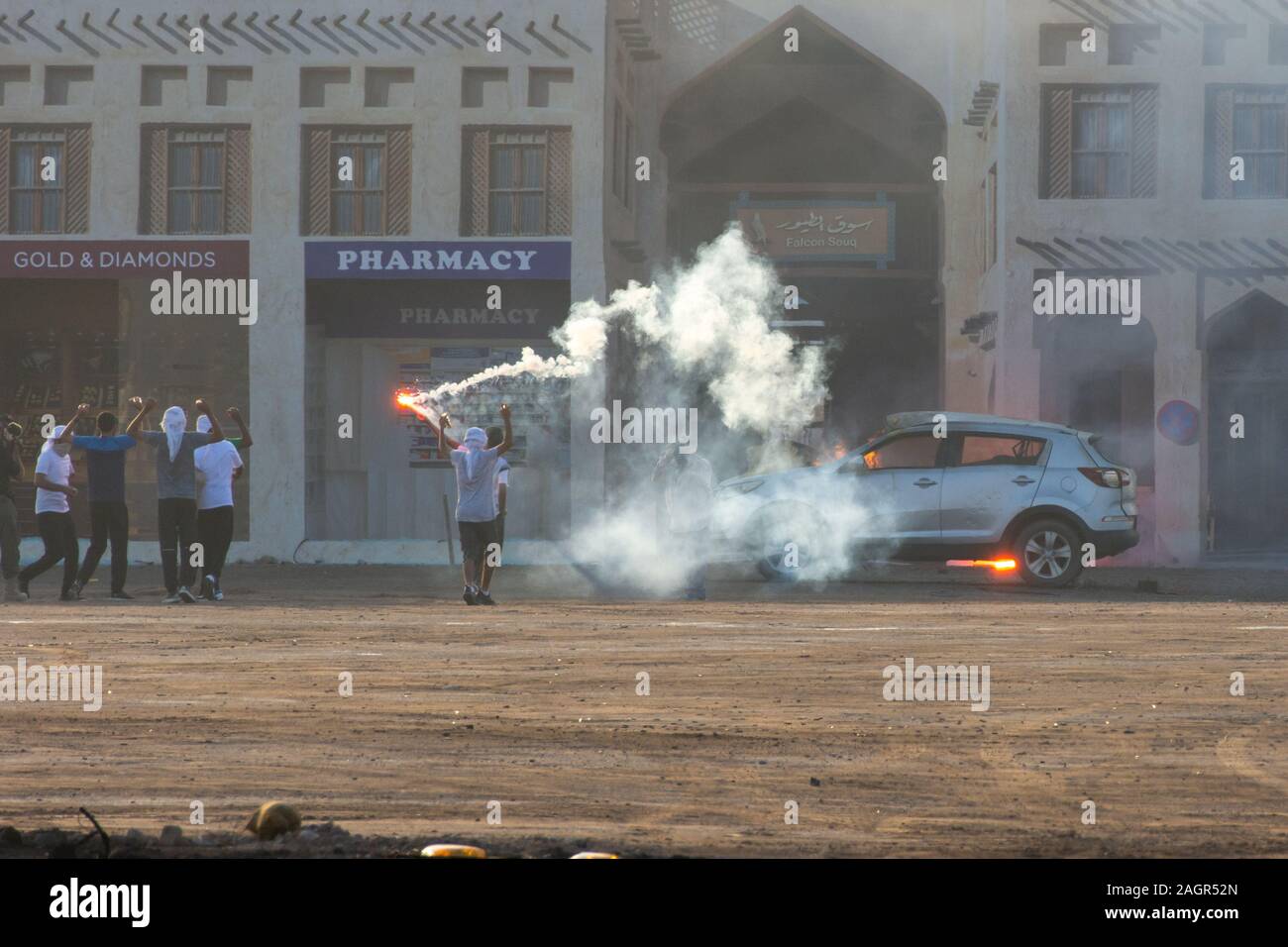 Military police riot response to a protest with tear gas, smoke, fire, explosions. Political expression, riot, protest, demostration and military conc Stock Photo