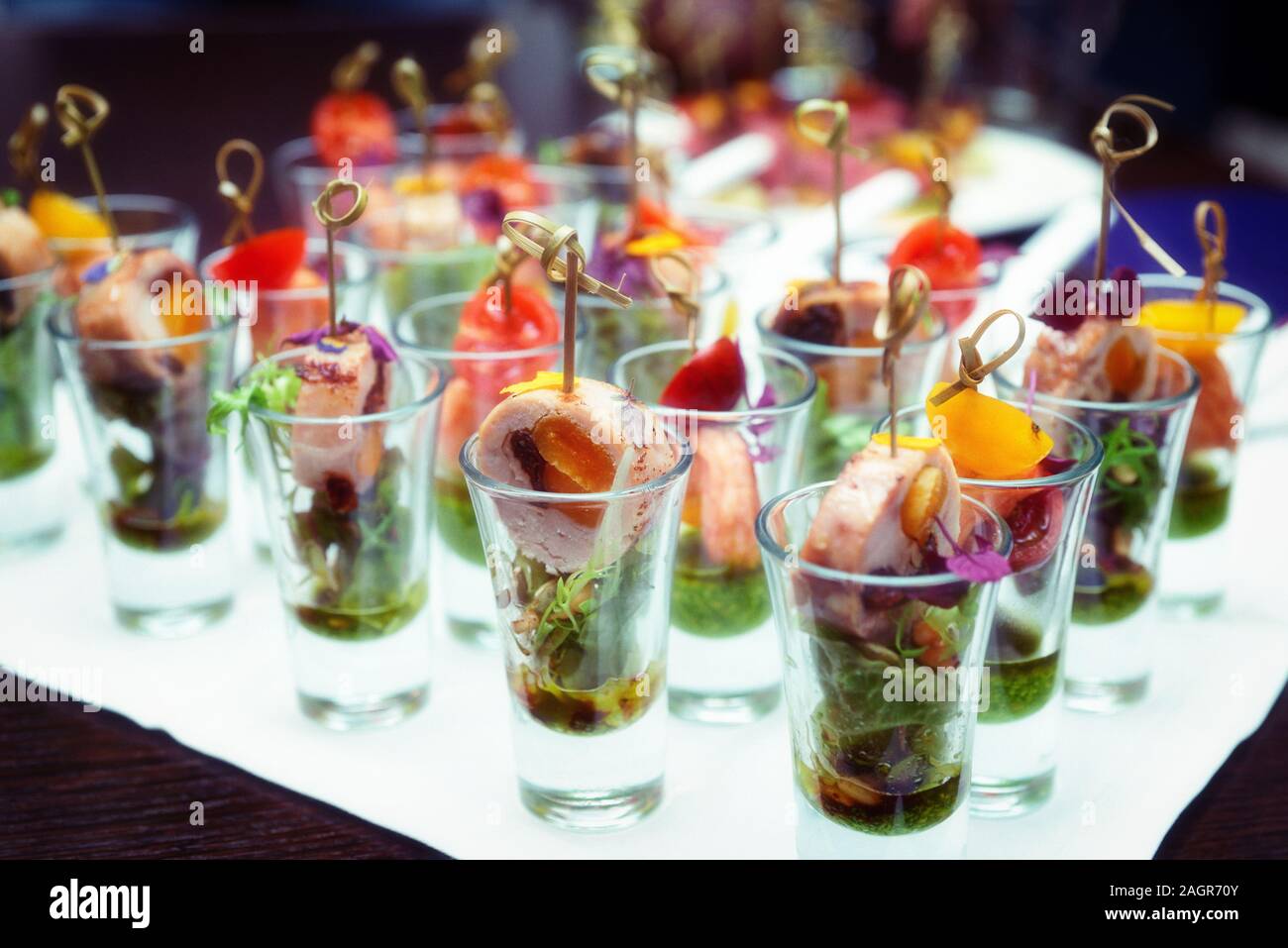 Various snacks in shot glasses on table Stock Photo Alamy