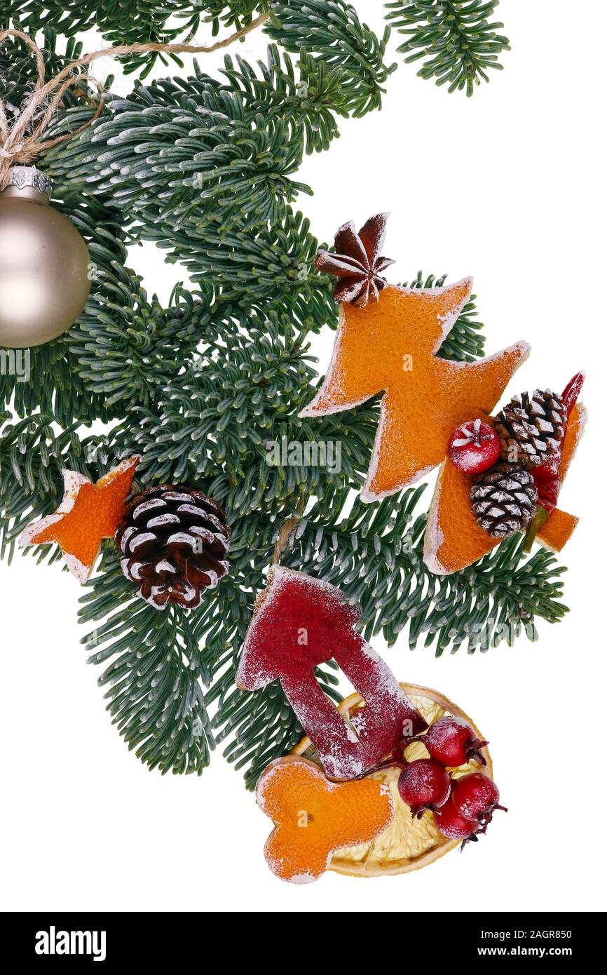 Christmas homemade decoration objects on fir tree branches made of dry