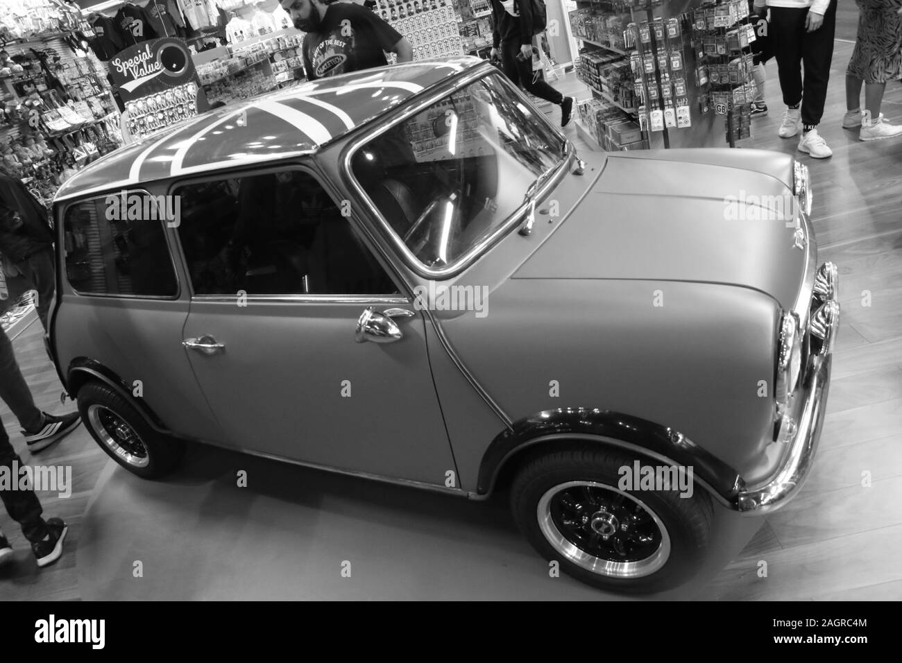 August 18, 2019 – Embankment, London, United Kingdom. An iconic and tiny British car, the Mini, sits on display in a small shop in the middle of Londo Stock Photo