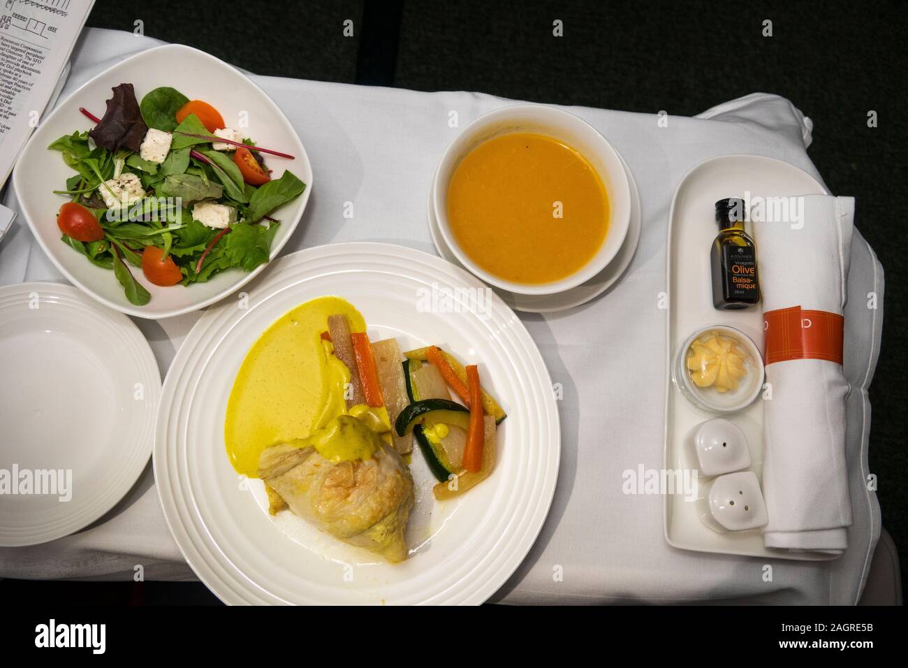 Air Travel, Ethiopian Airlines Boeing 787 Dreamliner, Cloud 9 Business Class in flight diabetic meal, chicken with mustard sauce and sauteed vegetable Stock Photo