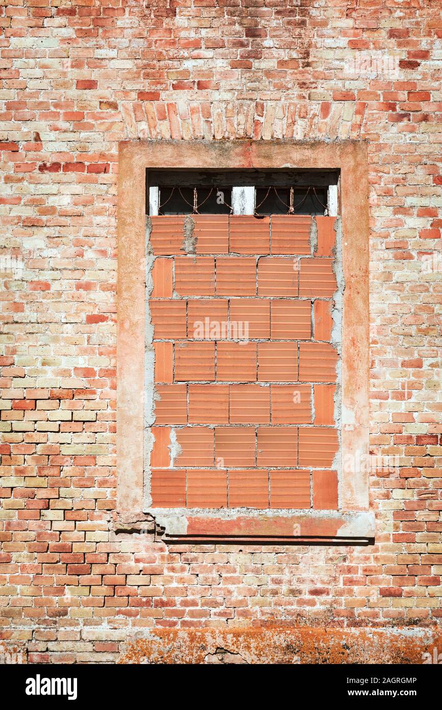 Front view of brick building, walled window Stock Photo - Alamy