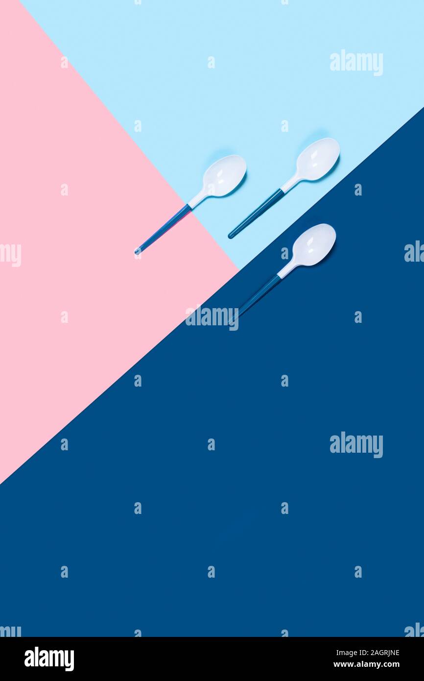 Dangerous three plastic spoons. Environmental problem of plastic