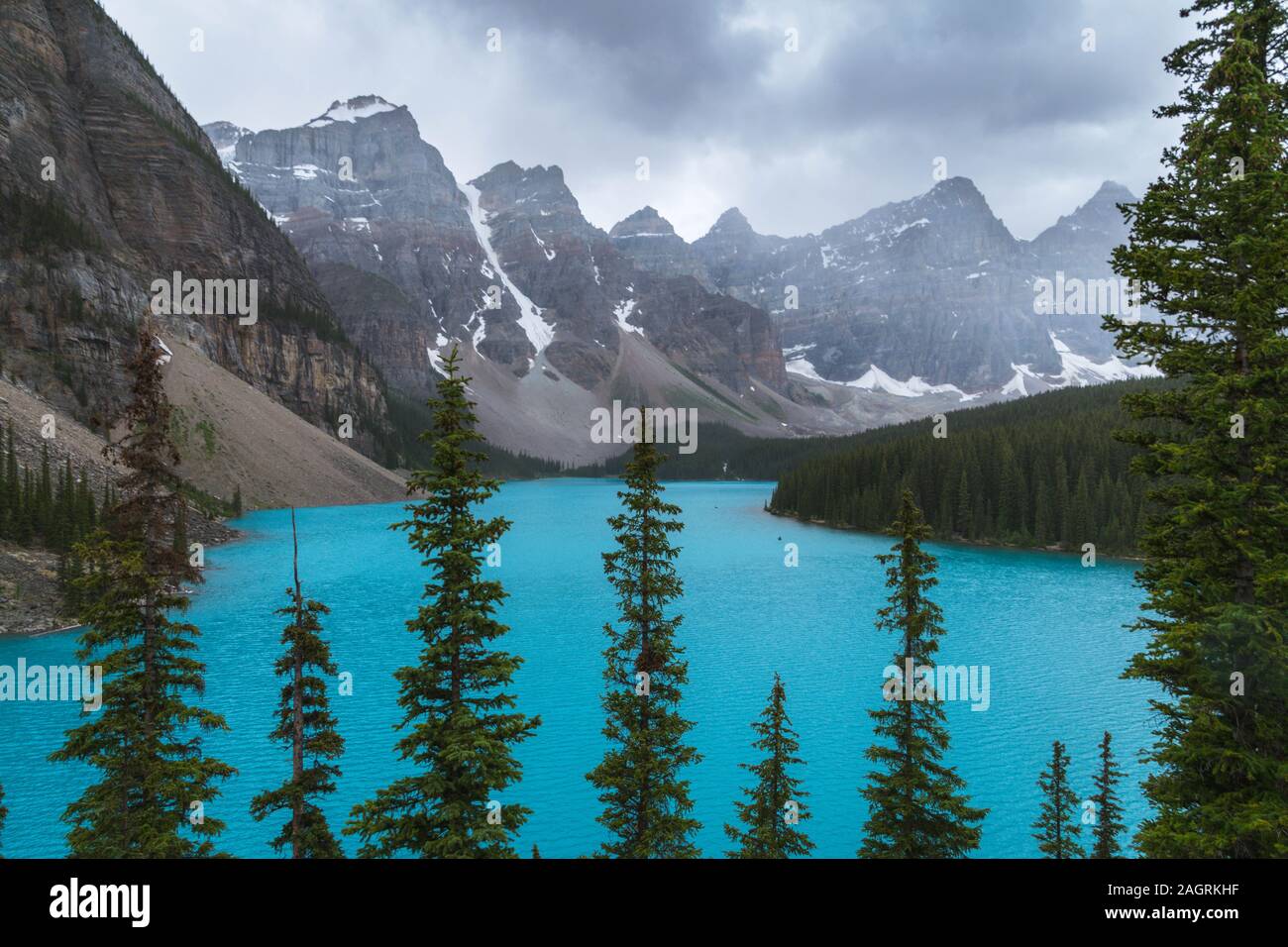 Stormy incredibly blue Moraine Lake in the Canadian Rockies Stock Photo ...