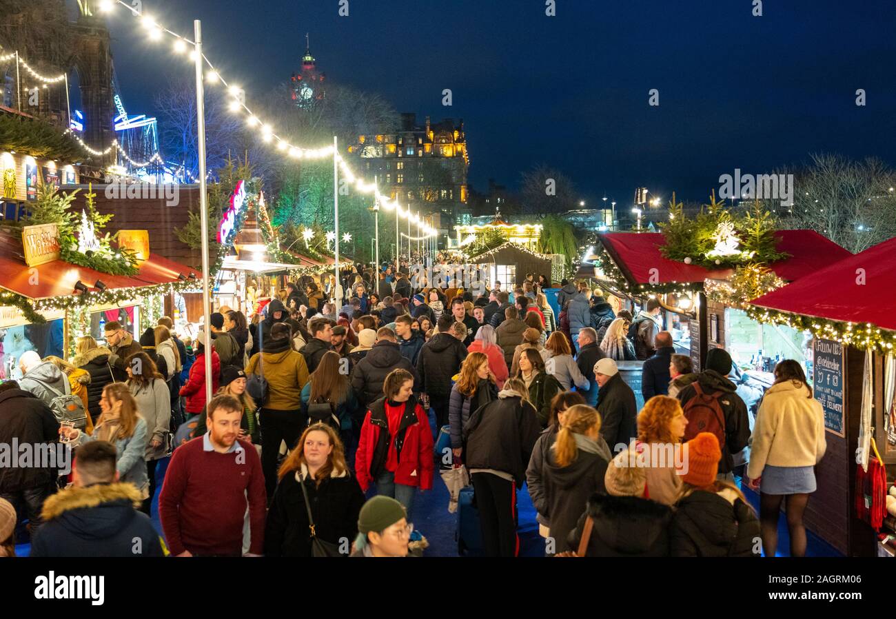 Crowds of people in busy Edinburgh Christmas Market in West Princes Street gardens in Edinburgh, Scotland, UK Stock Photo