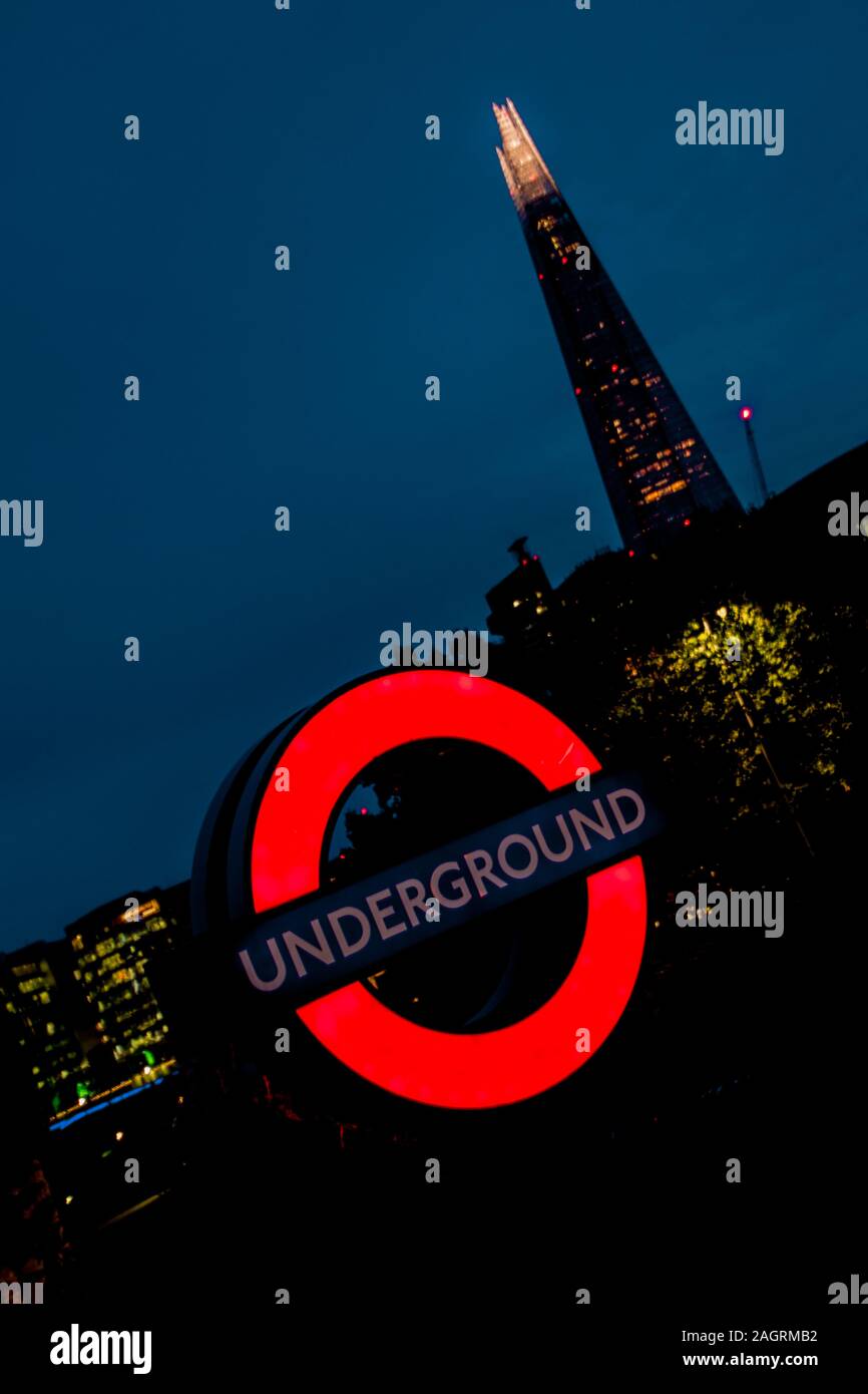 August 17, 2019 – Tower Hill, London, United Kingdom. A bright Underground sign at night. The London Underground is the fastest method to travel aroun Stock Photo