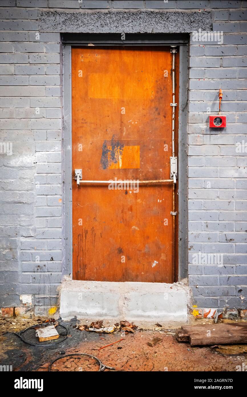Wooden emergency exit door in an old factory Stock Photo - Alamy