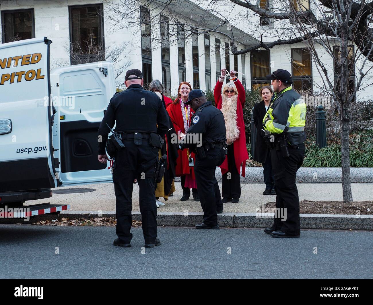 Washington, District of Columbia, USA. 20th Dec, 2019. Jane Fonda being led to United Capitol Police van after being arrested for civil disobedience in the Hart Office building during sit-in for Fire Drill Fridays, which calls attention to the need to take action to address the changing climate. Credit: Sue Dorfman/ZUMA Wire/Alamy Live News Stock Photo
