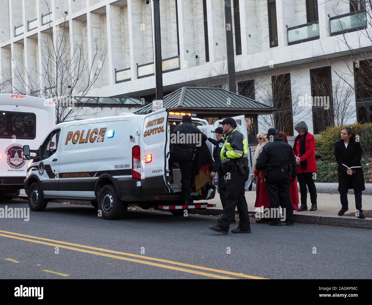 Washington, District of Columbia, USA. 20th Dec, 2019. Jane Fonda being led to United Capitol Police van after being arrested for civil disobedience in the Hart Office building during sit-in for Fire Drill Fridays, which calls attention to the need to take action to address the changing climate. Credit: Sue Dorfman/ZUMA Wire/Alamy Live News Stock Photo