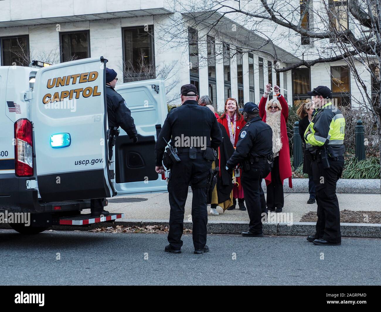 Washington, District of Columbia, USA. 20th Dec, 2019. Jane Fonda being led to United Capitol Police van after being arrested for civil disobedience in the Hart Office building during sit-in for Fire Drill Fridays, which calls attention to the need to take action to address the changing climate. Credit: Sue Dorfman/ZUMA Wire/Alamy Live News Stock Photo