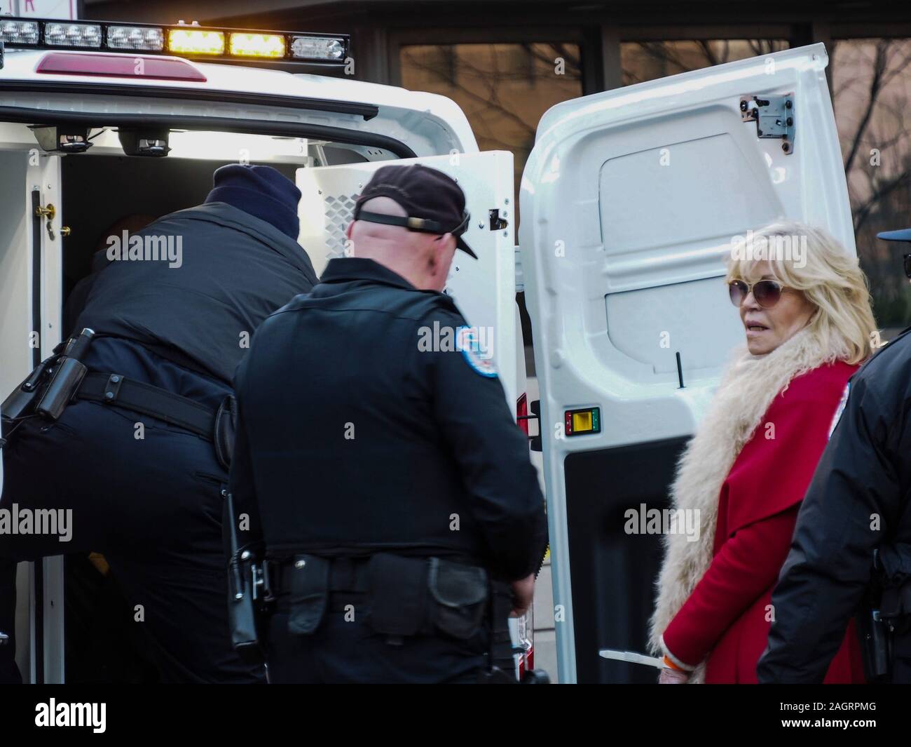 Washington, District of Columbia, USA. 20th Dec, 2019. Jane Fonda being led to United Capitol Police van after being arrested for civil disobedience in the Hart Office building during sit-in for Fire Drill Fridays, which calls attention to the need to take action to address the changing climate. Credit: Sue Dorfman/ZUMA Wire/Alamy Live News Stock Photo