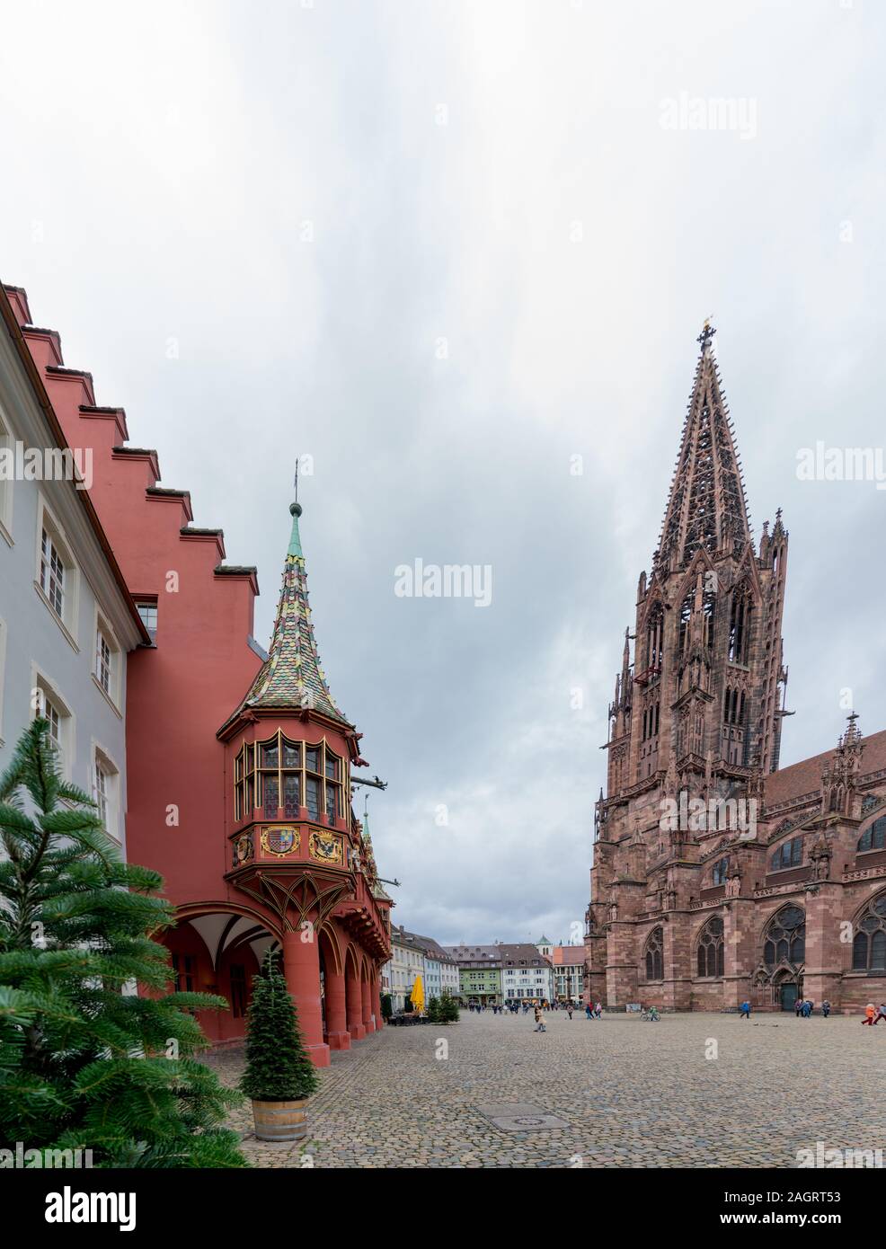Freiburg, Baden-Wuerttemberg / Germany - 15. December, 2019: view of tourists visiting the cathedral and minster in Freiburg in the Breisgau Stock Photo