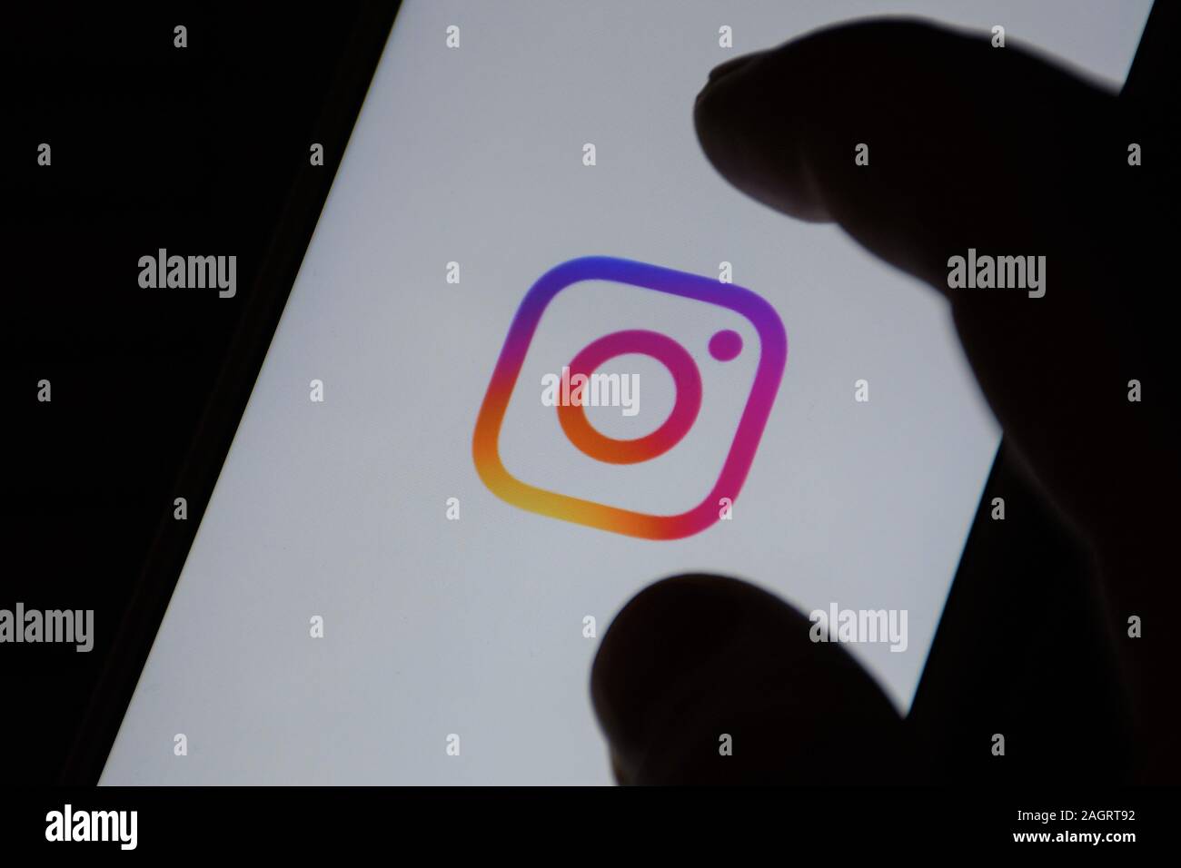 Instagram icon on monitor screen. Social network website. Social media, photography, photos. Social network, with finger Stock Photo