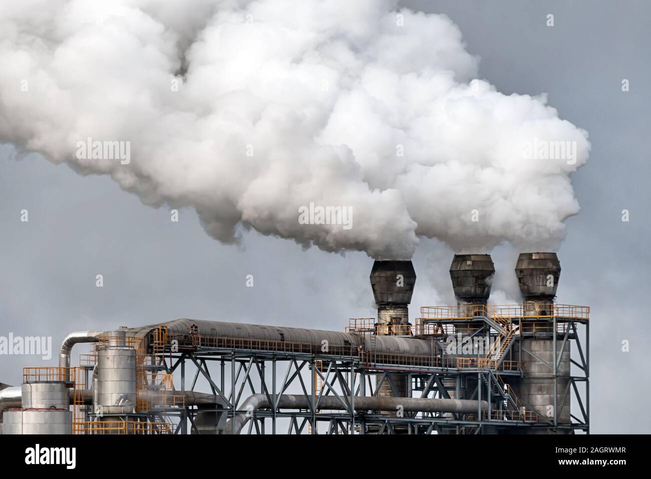 Chemical factory with smoke stack. Smoke emission from factory pipes. Ecology and environmental protection problems, air pollution Stock Photo