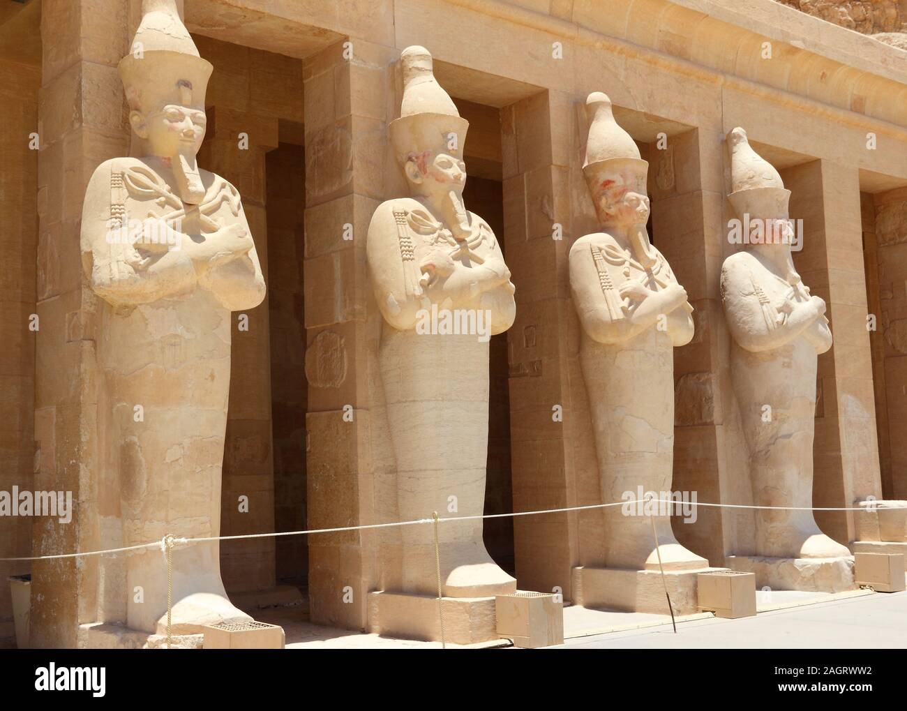 A row of statues of Queen Hatshepsut as Osiris, the god of the dead, at her temple in Luxor (Thebes), Egypt. Stock Photo